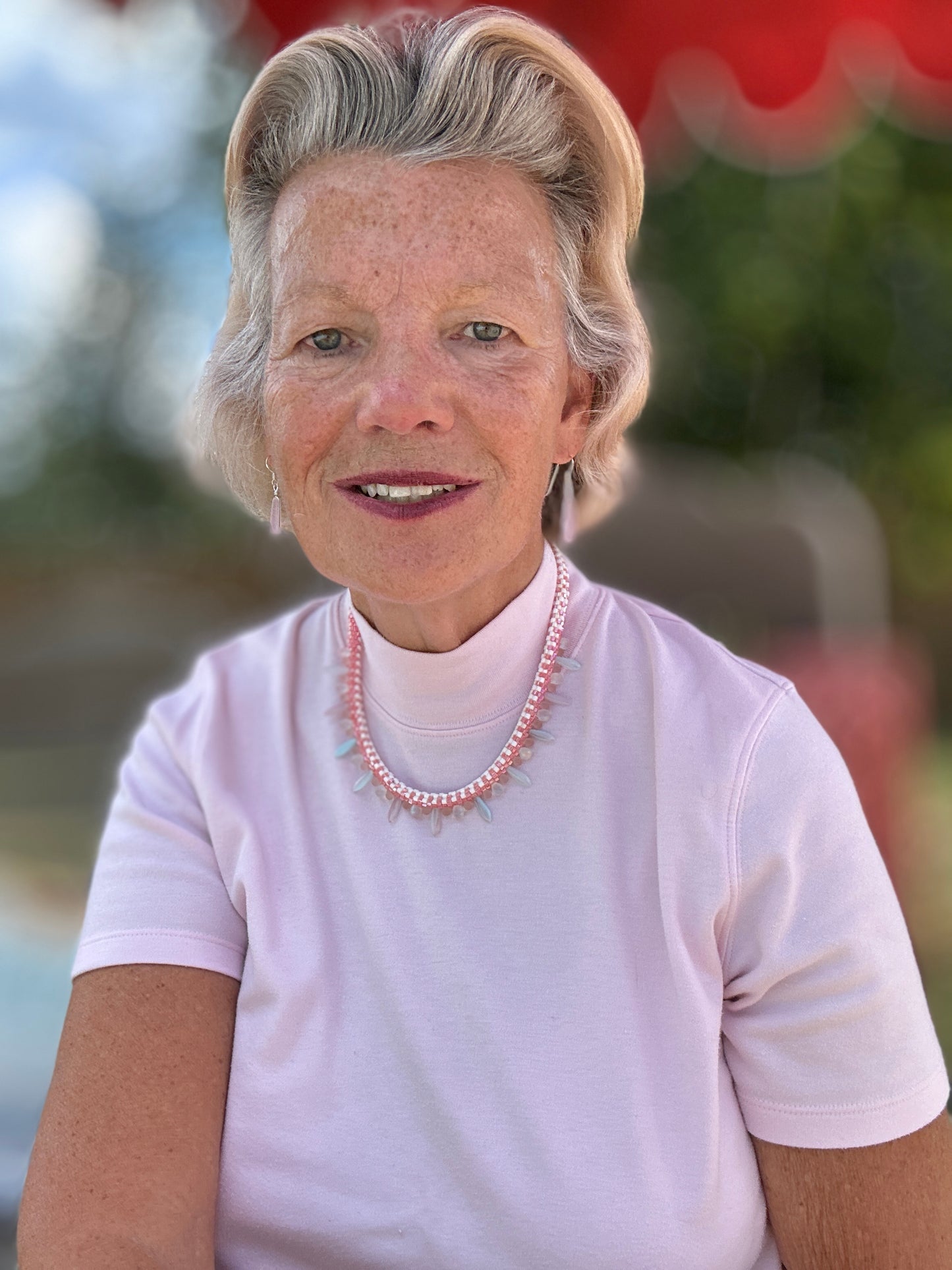 Delicate Pink Beaded Necklace with Iridescent Drop Accents