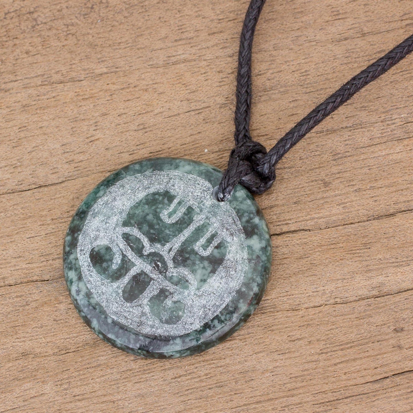 NOVICA Artisan Handmade Jade Pendant Necklace of Mayan Figure Aqabal from Guatemala Cotton [20 in min L x 40 in max L 2 mm W Pendant(s) 0.2 in H x 1.1 in Diam.] ' Aq' Ab' Al Medallion'